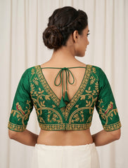 Luxury Emerald Green raw silk Saree Blouse with Gold Peacock and Floral Zari Embroidery – V-Neck Backless Design with Latkan Tassels